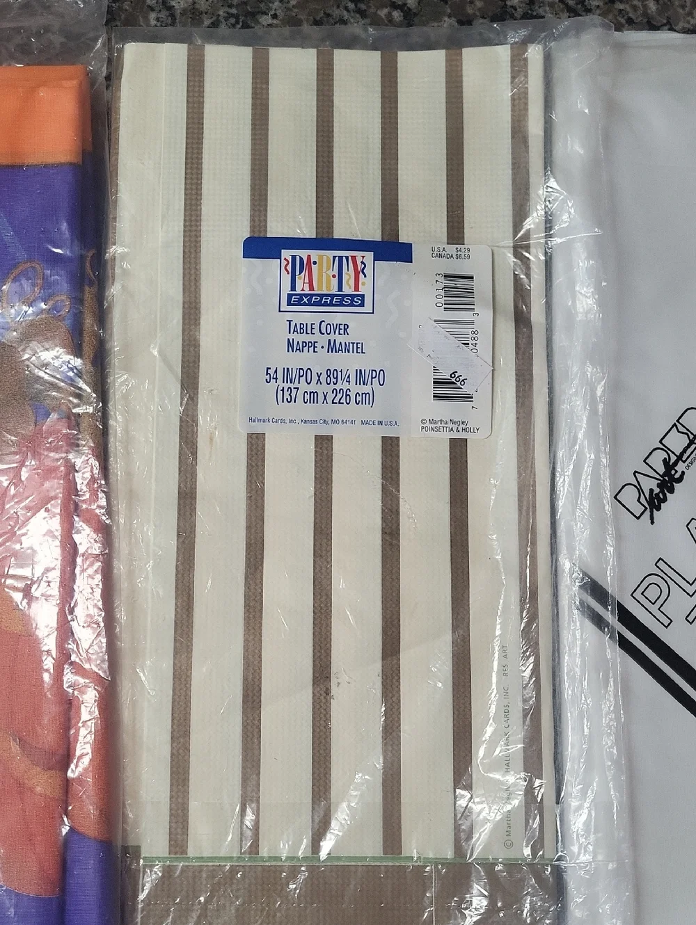 Lot of 3 new plastic tablecovers pumpkin, white and gold/ biege strips.